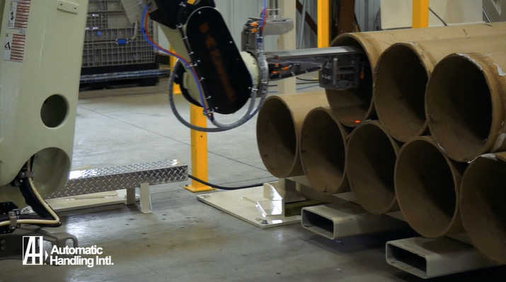 A robotic core handling machine loads a core for processing