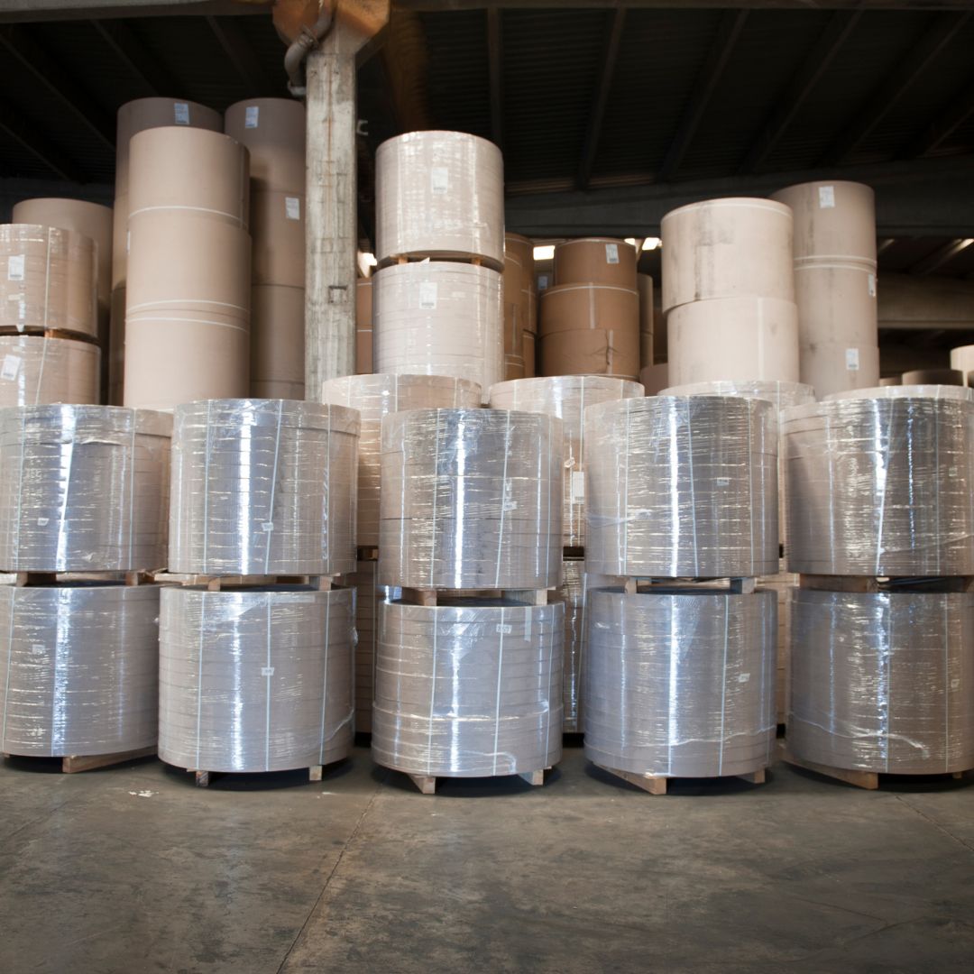 Stacks of wrapped paper rolls